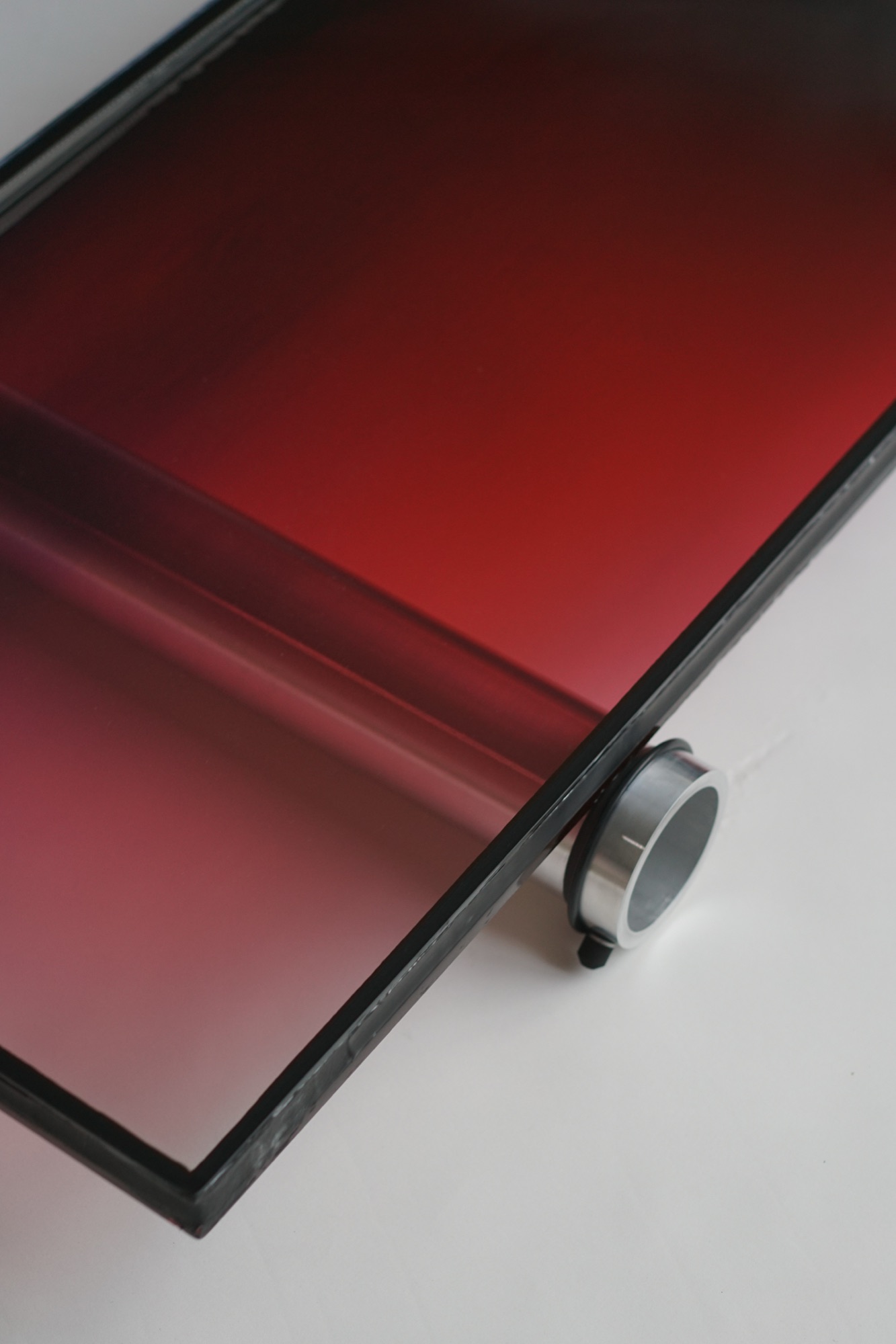 wave chamber — liquid-filled glass pane with shifting color gradients